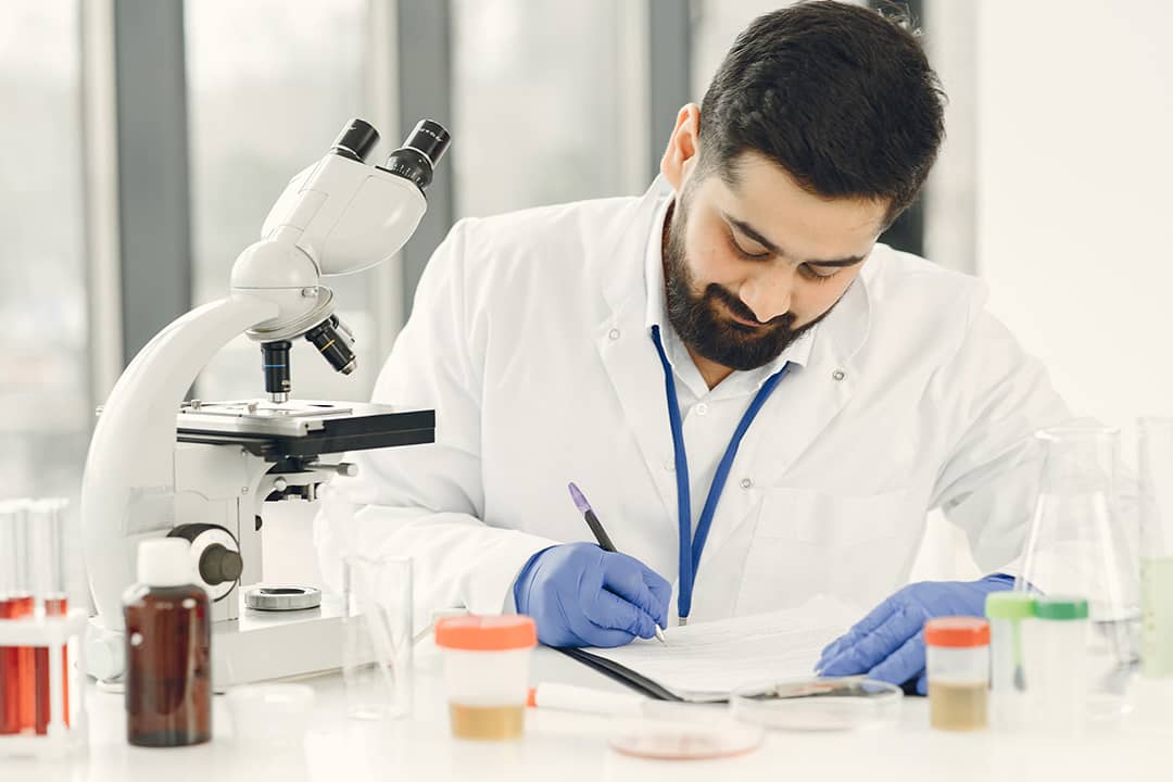A medical technologist completing diagnostic results of patients in a clinical laboratory.